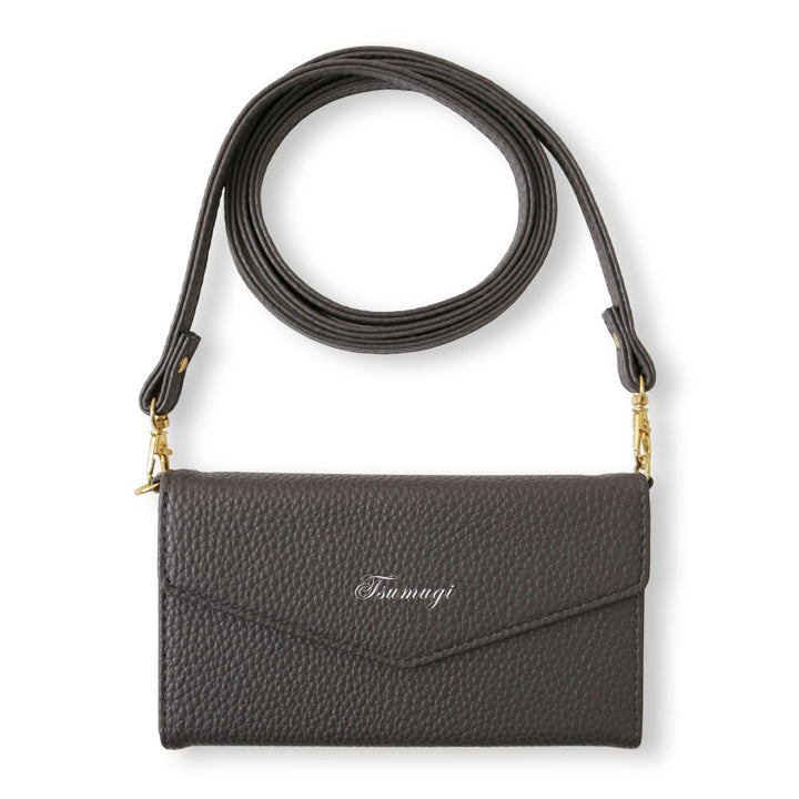 Vegan leather tri-fold dusty color printed name strap attached notebook-style case