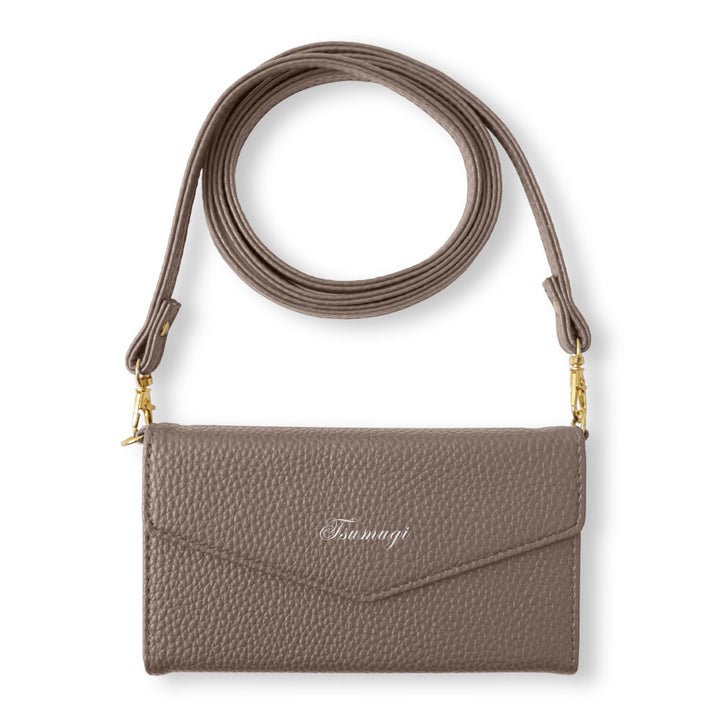 Vegan leather tri-fold dusty color printed name strap attached notebook-style case