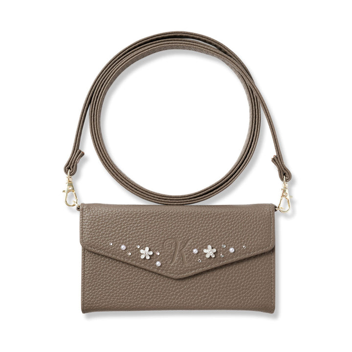 Vegan leather tri-fold dusty color initial deco strap-attached notebook-style case